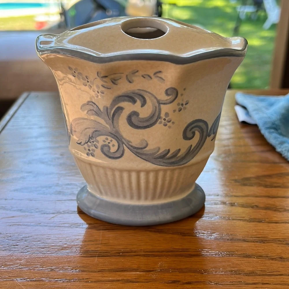 Spring maid tooth brush holder